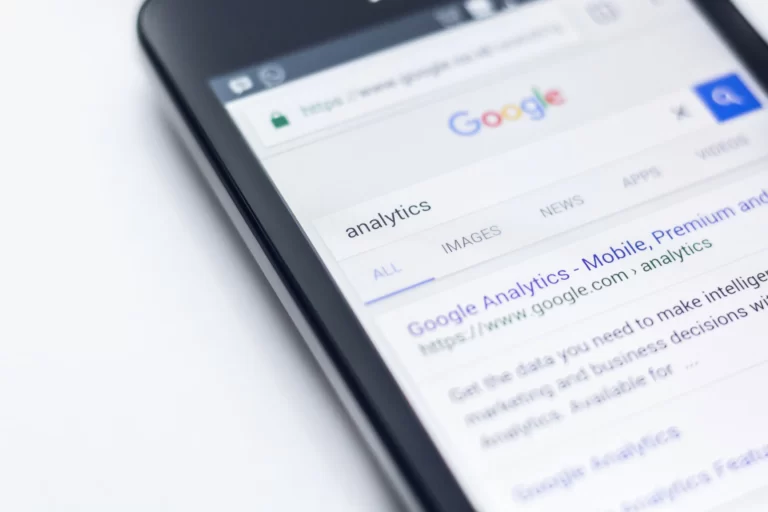 a phone openeing a google browser searching for the keyword analytics